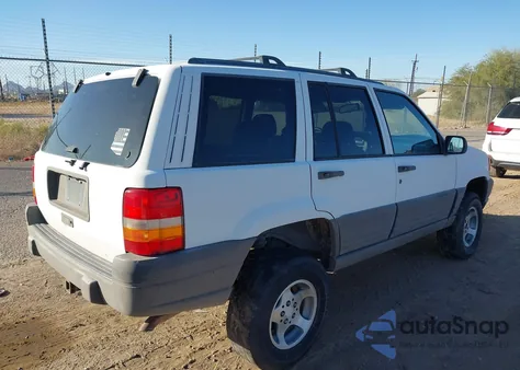 1997 Jeep Grand Cherokee Laredo/Tsi из США, поврежденный, VIN 1J4GZ58S0VC771193